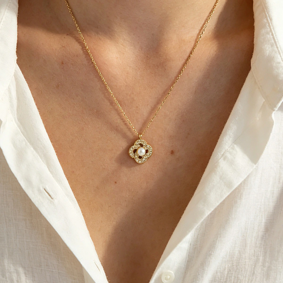Zircon Pendant Encircling A Pearl Necklace