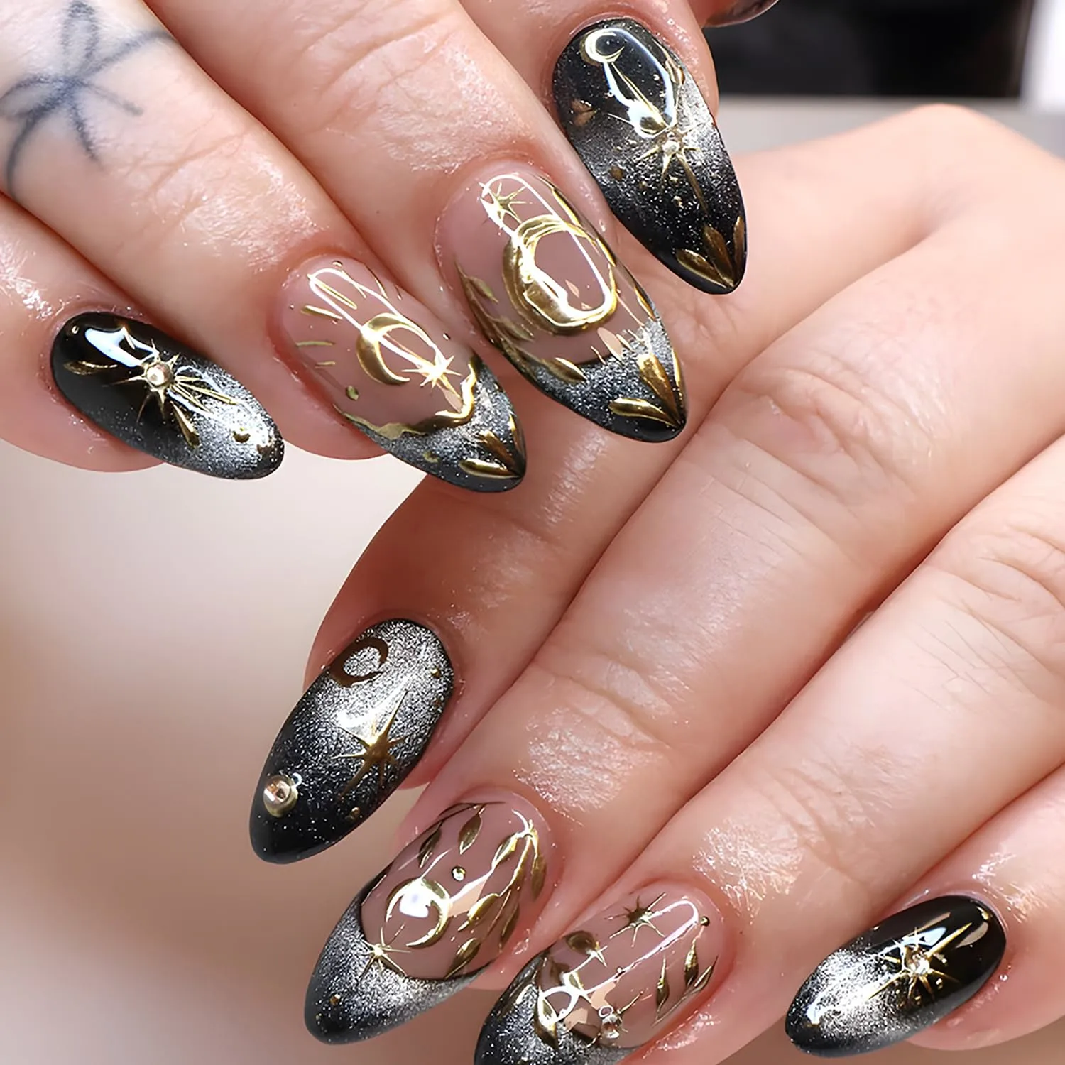 24Pcs Black Press on Nails Medium Almond Fake Nails with Glitter Designs Stars Moon Leaves False Nails Black French Tip Acrylic Nail Star Rhinestones Full Cover Glue on Nails for Women Nail Art