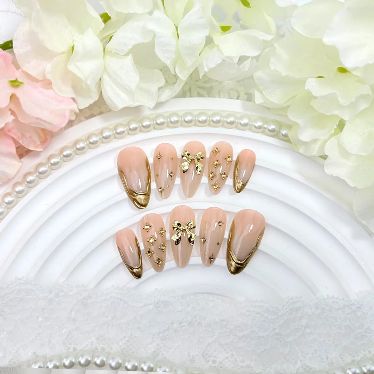 24Pcs Gold French Tip Press on Nails Medium Almond Luxury Fake Nails with Bow Crystal Charms Design Nude Pink Acrylic Nails Supplies for Women Daily Nail Decor Supplies