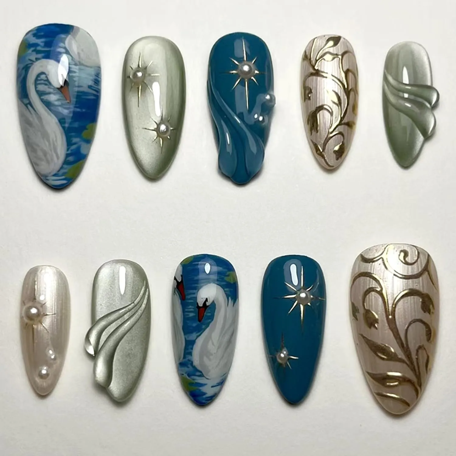 24Pcs White Swan Press on Nails Medium Almond Fake Nails Gold Star False Nails with 3D Pearls Charms Design False Nails Glossy Dark Blue Glue on Nail Gold Flower Leaf Artificial Nails for Women