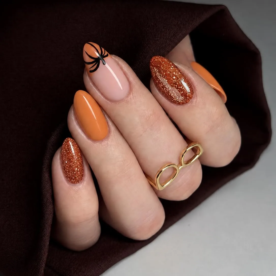 UNA GELLA Halloween Press On Nails Short Almond, 32Pcs Pumpkin Fake Nails Soft Gel Nail Tips Almond Shape in 16 Sizes with Semi Glue and Jelly Tabs, Orange Glitter Finish for Party Fall Manicures